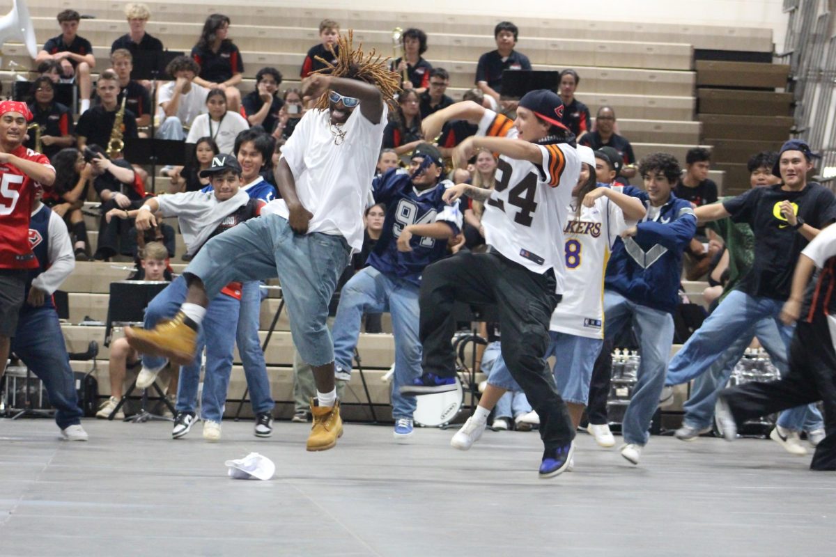 Nicholas Clark (12) and Brad Yoakley (12) participate in the Senior dance skit. The seniors were given the 2000s decade to perform to.